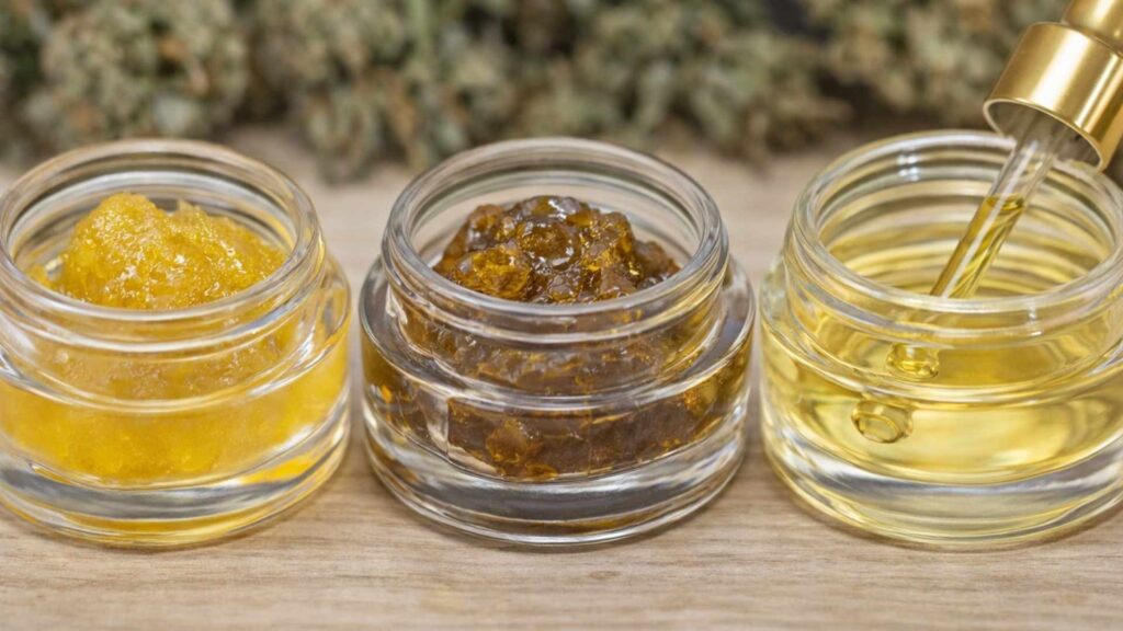 Rosin vs resin vs distillate shown in three glass jars with different concentrate textures on a wooden surface